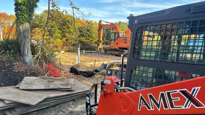 AMEX excavator at an autumn construction site