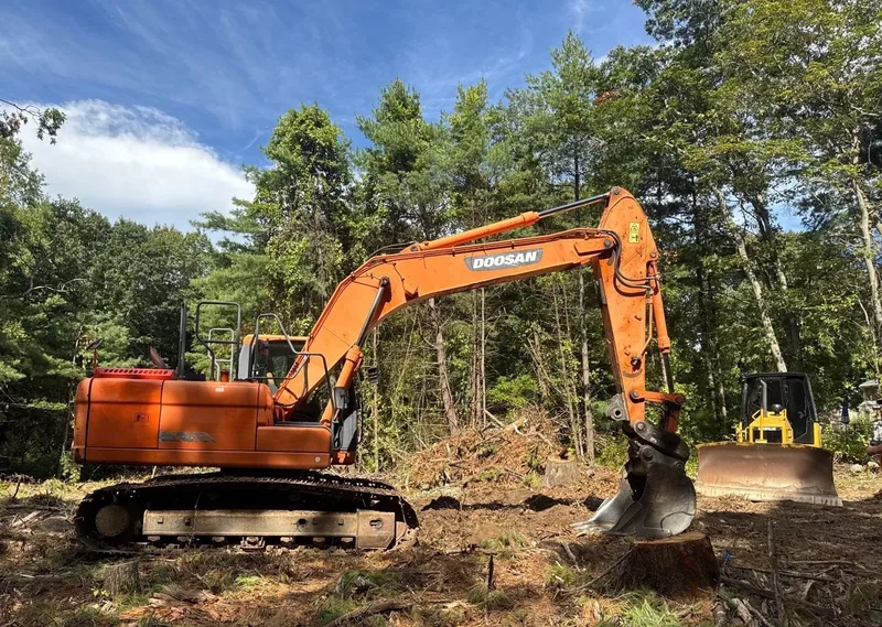 Doosan and dozer during site clearing and land prep